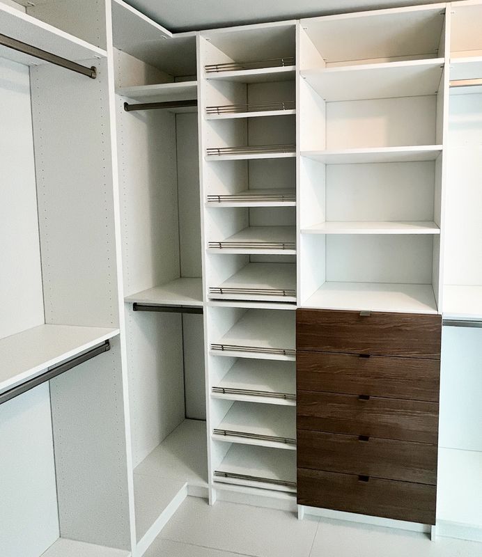 White closet with walnut drawers